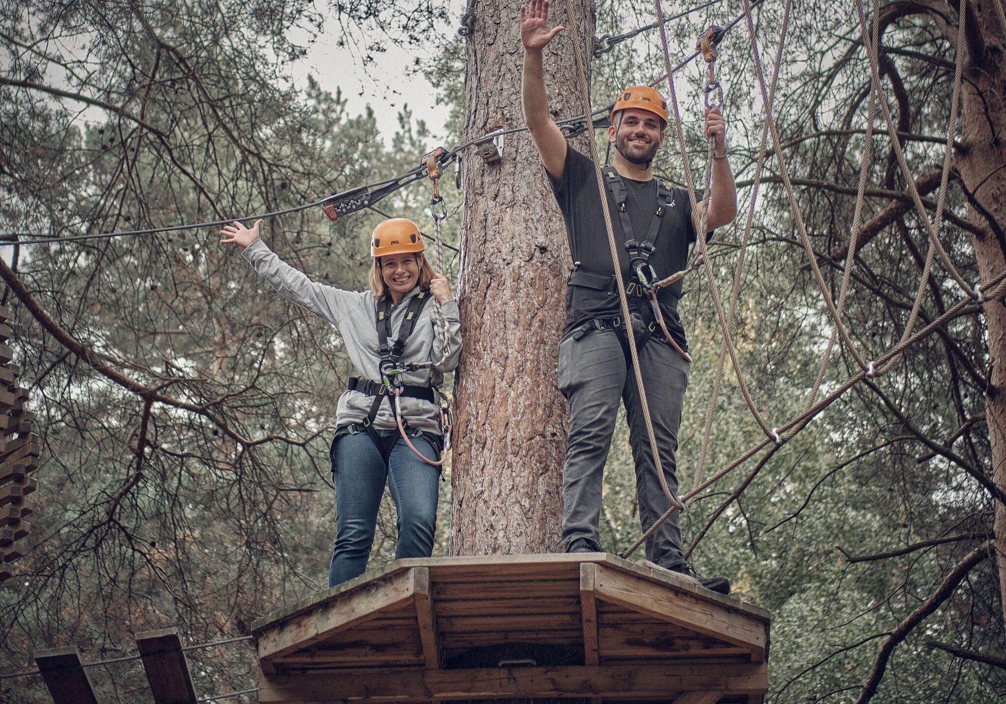 Senior Solutions Consulant Jenny and Customer Success Manager Tom braving the treetops